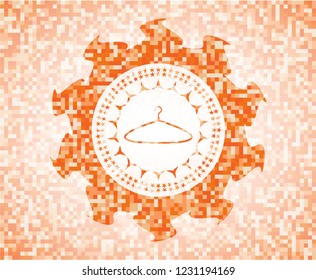 hanger icon inside orange mosaic emblem