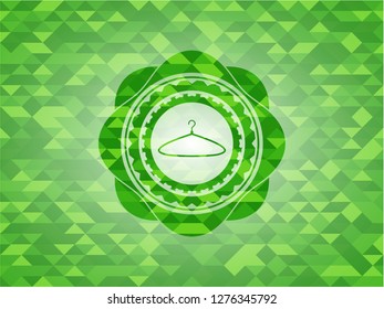 hanger icon inside realistic green mosaic emblem