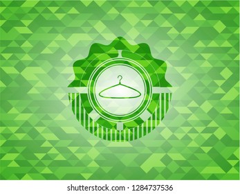 hanger icon inside realistic green mosaic emblem