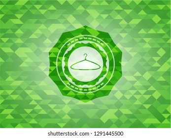 hanger icon inside realistic green mosaic emblem