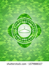 hanger icon inside realistic green emblem. Mosaic background