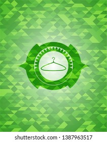 hanger icon inside realistic green mosaic emblem