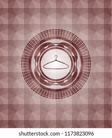 hanger icon inside red emblem with geometric pattern background. Seamless.