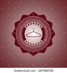 icono del colgador dentro del emblema rojo