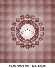 hanger icon inside red seamless badge with geometric background.