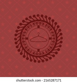 hanger icon inside retro red emblem. 