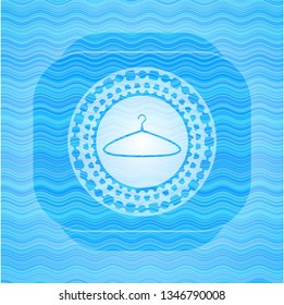 hanger icon inside sky blue water wave style badge.