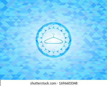 hanger icon inside sky blue emblem with triangle mosaic background
