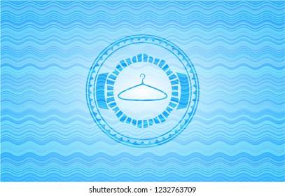 hanger icon inside water representation emblem.