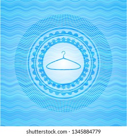 hanger icon inside water wave representation badge background.