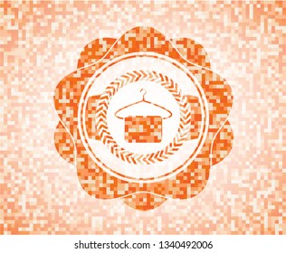 hanger with towel icon inside abstract orange mosaic emblem with background