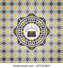 hanger with towel icon inside arabesque style emblem. arabic decoration.