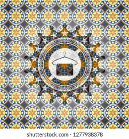 hanger with towel icon inside arabic style badge. Arabesque decoration.