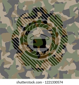 hanger with towel icon inside camouflage texture