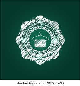 hanger with towel icon inside chalk emblem