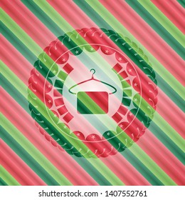 hanger with towel icon inside christmas emblem.