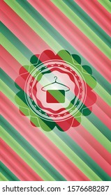 hanger with towel icon inside christmas emblem background.