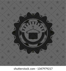hanger with towel icon inside dark badge or emblem