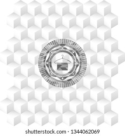 hanger with towel icon inside grey icon or emblem with geometric cube white background
