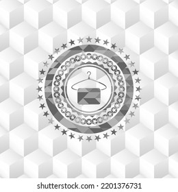 hanger with towel icon inside grey badge with geometric cube white background. 