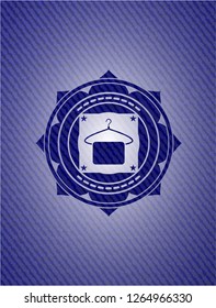 hanger with towel icon inside jean or denim emblem or badge background