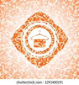 hanger with towel icon inside orange mosaic emblem with background