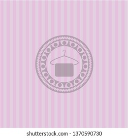 hanger with towel icon inside pink emblem
