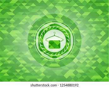 hanger with towel icon inside realistic green emblem. Mosaic background