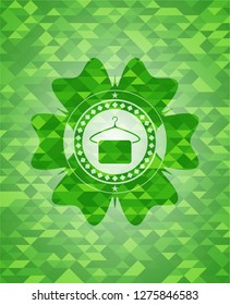 hanger with towel icon inside realistic green mosaic emblem