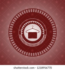 hanger with towel icon inside red emblem