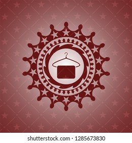 hanger with towel icon inside red emblem