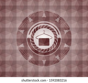 hanger with towel icon inside red seamless badge with geometric background.