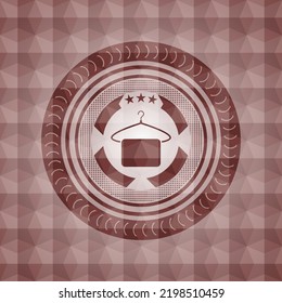 hanger with towel icon inside red seamless polygonal badge. 