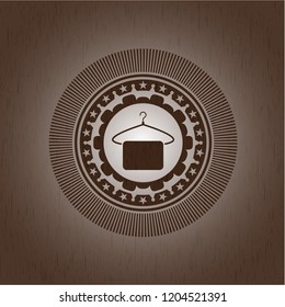 hanger with towel icon inside retro wood emblem