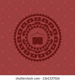 hanger with towel icon inside retro style red emblem
