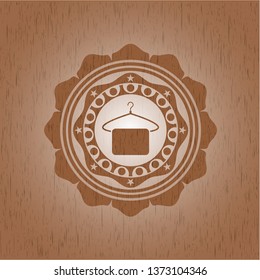 hanger with towel icon inside retro wood emblem