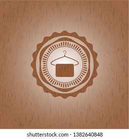 hanger with towel icon inside retro style wooden emblem