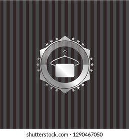 hanger with towel icon inside silvery badge or emblem