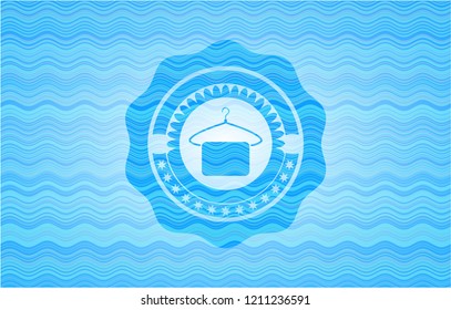 hanger with towel icon inside sky blue water emblem.