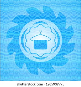 hanger with towel icon inside sky blue water badge background.