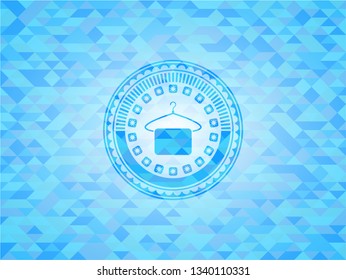 hanger with towel icon inside sky blue emblem with triangle mosaic background