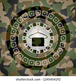 hanger with towel icon on camouflage texture