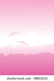 Hang-gliders at a dawn in mountains