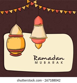 Hanging arabic lanterns on brown and beige background for celebrations of Islamic holy month of prayers, Ramadan Mubarak. 