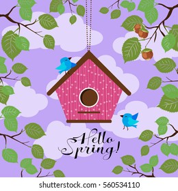 Hanging birdhouse with a hole in the shape of a heart. And two yellow birds. Hello, Spring!
