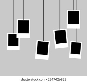 Hanging black and white photo paper decoration. Drying process 