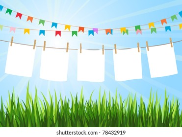 Hanging blank paper on clothesline in field. Sunny day. Festive flags. Blank white space.