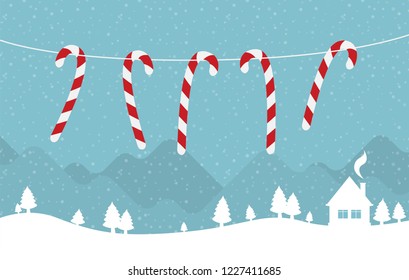 Hanging candy canes in snowy winter scene