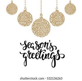 Hanging Christmas ball with a floral swirl. Hand drawn calligraphy Season greetings lettering. design holiday greeting cards and invitations of Merry Christmas and Happy New Year and seasonal holidays
