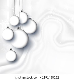 Hanging Christmas baubles on a white marble style texture
